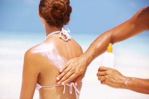 applying sunscreen | rashon